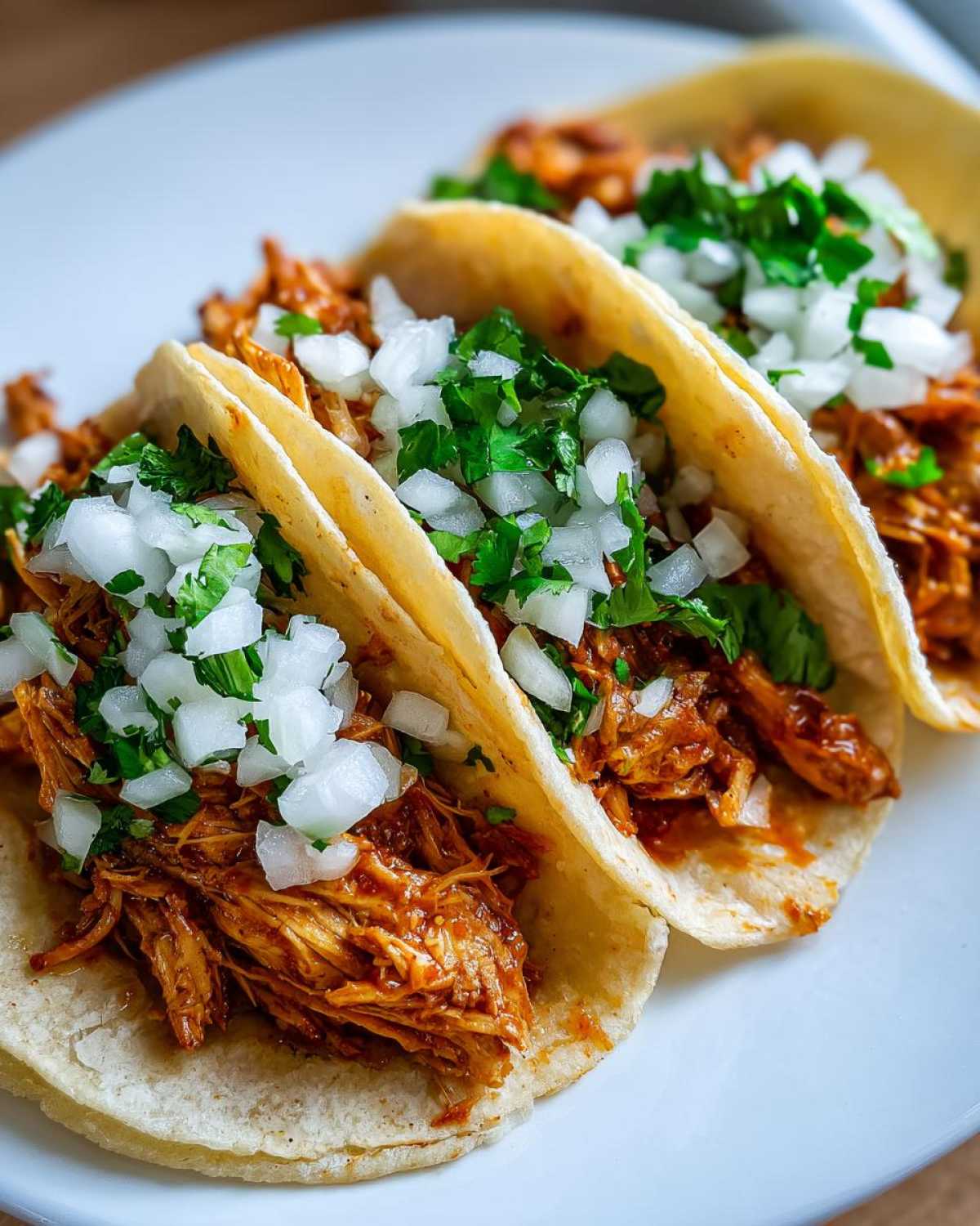Three amazing chicken tacos close up 1