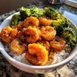 Close-up of a Honey Garlic Shrimp Bowl Quick Dinner featuring glazed shrimp, steamed broccoli, and white rice.