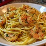 Close-up of Lemon Butter Shrimp Pasta tossed in a light sauce with visible parsley and garlic.