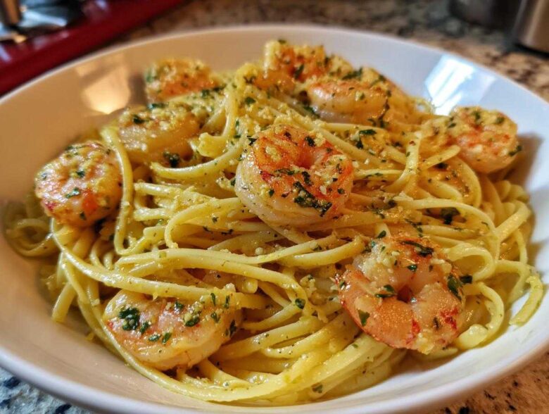 Close-up of Lemon Butter Shrimp Pasta tossed in a light sauce with visible parsley and garlic.